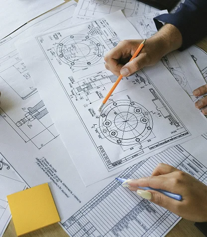 Designer reviewing architectural drawings