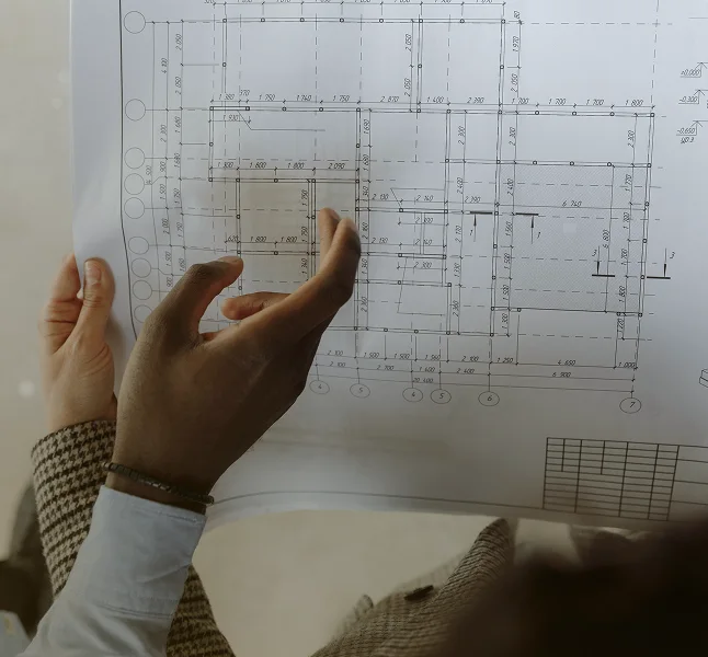 Designer checking construction documentation