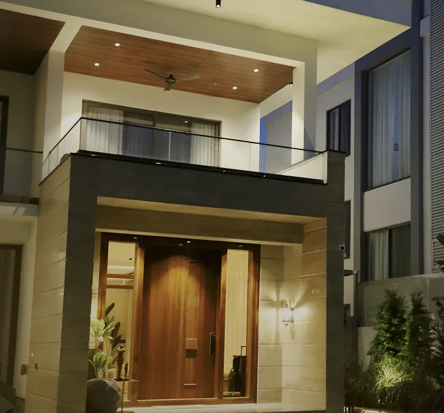 Contemporary completed home with an illuminated entrance