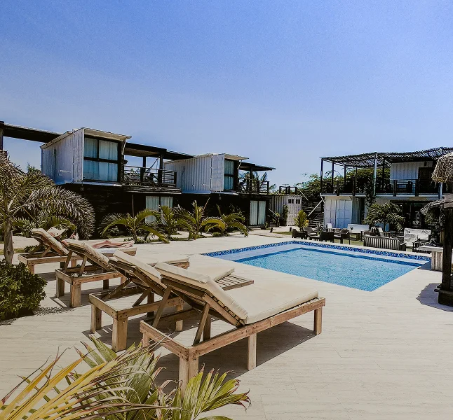 Completed modern homes beside a landscaped pool
